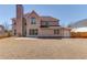 Spacious backyard with a large lawn and patio area, ideal for outdoor activities and relaxation at 4155 Cami Way, Buford, GA 30519