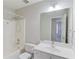 Cozy bathroom with shower-tub combo, white vanity with large mirror, and updated faucet at 4155 Cami Way, Buford, GA 30519