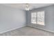 Serene bedroom with a neutral color scheme and natural light streaming through the window at 4155 Cami Way, Buford, GA 30519