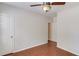 Bright bedroom featuring beautiful wood-look flooring, ceiling fan, and a neutral color palette at 4155 Cami Way, Buford, GA 30519
