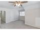Spacious bedroom with high ceilings, neutral walls, new carpet, and a ceiling fan at 4155 Cami Way, Buford, GA 30519