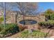 Attractive stone entrance sign for Ellsworth Glen, surrounded by lush landscaping and mature trees at 4155 Cami Way, Buford, GA 30519
