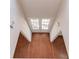 Inviting entryway with wood-look floors and double doors leading to outdoor space at 4155 Cami Way, Buford, GA 30519