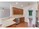 Open kitchen with stainless steel dishwasher and gas range adjacent to the breakfast bar at 4155 Cami Way, Buford, GA 30519