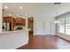 Eat-in kitchen featuring stainless steel appliances and a breakfast bar with a view of the Gathering room at 4155 Cami Way, Buford, GA 30519