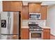 Well-appointed kitchen features stainless steel appliances and ample counter space for meal preparation at 4155 Cami Way, Buford, GA 30519