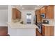 Modern kitchen featuring stainless steel appliances and a breakfast bar, perfect for casual dining at 4155 Cami Way, Buford, GA 30519
