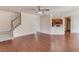 Open-concept living room with hardwood floors and a staircase leading to the second floor at 4155 Cami Way, Buford, GA 30519