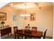 Elegant dining room with coffered ceiling, wainscoting, and a chandelier at 1440 Gallup Dr, Stockbridge, GA 30281