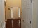 Welcoming entryway with hardwood floors, white door, and side windows for natural light at 1440 Gallup Dr, Stockbridge, GA 30281