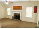 Bright living room with fireplace, neutral walls, and multiple windows at 1440 Gallup Dr, Stockbridge, GA 30281
