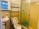 Bathroom with toilet, sink, and shower with tile at 3727 Dial Dr, Stone Mountain, GA 30083