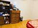Bedroom featuring wood floors, dresser, and built in shelving for clothes at 3727 Dial Dr, Stone Mountain, GA 30083