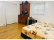 Bedroom featuring wood floors, bed, and wardrobe at 3727 Dial Dr, Stone Mountain, GA 30083
