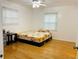 Bedroom featuring wood floors, bed, and side table at 3727 Dial Dr, Stone Mountain, GA 30083