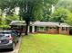 Lovely brick home with a well-manicured lawn and a classic, timeless design at 3727 Dial Dr, Stone Mountain, GA 30083