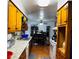 Classic kitchen with wooden cabinets and a dining area at 3727 Dial Dr, Stone Mountain, GA 30083