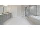 Bathroom with tile flooring, a glass-enclosed shower and a soaking tub at 4402 Income Cir, Ellenwood, GA 30294