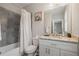 Well-lit bathroom with tile flooring and granite countertops at 4402 Income Cir, Ellenwood, GA 30294