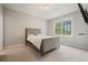 Cozy bedroom with plush carpet and a window with green views at 4402 Income Cir, Ellenwood, GA 30294