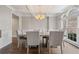 Formal dining room featuring coffered ceilings, hardwood flooring, and natural light at 4402 Income Cir, Ellenwood, GA 30294
