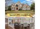 Elegant stone home with a manicured lawn and inviting facade at 4402 Income Cir, Ellenwood, GA 30294