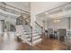 Grand foyer with hardwood floors, staircase, and coffered ceiling dining room at 4402 Income Cir, Ellenwood, GA 30294