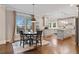 Open concept kitchen and dining area with stainless appliances and hardwood floors at 4402 Income Cir, Ellenwood, GA 30294