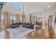 Open-concept living room with hardwood floors and abundant natural light at 4402 Income Cir, Ellenwood, GA 30294