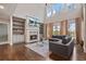 Bright living room with fireplace, built-ins, and floor-to-ceiling windows at 4402 Income Cir, Ellenwood, GA 30294