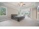 Spacious main bedroom featuring trey ceilings, large windows, and sitting area at 4402 Income Cir, Ellenwood, GA 30294