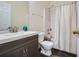 Clean bathroom with modern sink, well-maintained fixtures, and a shower-tub combination with a shower curtain at 5997 Tate Dr, Austell, GA 30106