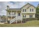 Charming two-story home with a welcoming front porch, manicured lawn, and classic curb appeal at 5997 Tate Dr, Austell, GA 30106