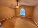 Large bedroom with a ceiling fan and a window, creating a comfortable and relaxing space at 709 Kilkenny Cir, Lithonia, GA 30058
