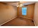 Bedroom with carpet, ceiling fan and window providing natural light at 709 Kilkenny Cir, Lithonia, GA 30058