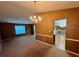 Open concept dining and living room area at 709 Kilkenny Cir, Lithonia, GA 30058