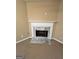 Close-up of a fireplace with marble hearth and white mantle, adding charm and character to the space at 709 Kilkenny Cir, Lithonia, GA 30058