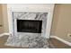 Close up of white fireplace with marble surround at 709 Kilkenny Cir, Lithonia, GA 30058