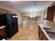 Kitchen has stainless appliances and tile floor at 709 Kilkenny Cir, Lithonia, GA 30058