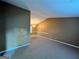 Bright, open living room with neutral walls, carpet, and abundant natural light, creating a serene ambiance at 709 Kilkenny Cir, Lithonia, GA 30058