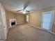 Spacious living room with fireplace and neutral walls, providing a cozy atmosphere and access to the exterior at 709 Kilkenny Cir, Lithonia, GA 30058
