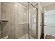 Clean bathroom featuring a glass walk-in shower with modern gray tiling at 2771 Aralynn Way, College Park, GA 30337