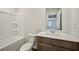 Bathroom featuring modern toilet, shower and vanity with lots of counter space at 2771 Aralynn Way, College Park, GA 30337