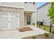 Exterior showcasing the brick facade, two-car garage, front entrance and landscaped yard at 2771 Aralynn Way, College Park, GA 30337