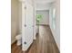 Hallway with wood floors, a bathroom, staircase, and natural light at 2771 Aralynn Way, College Park, GA 30337