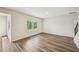 Bright living room featuring wood floors, neutral walls, and natural light from large windows at 2771 Aralynn Way, College Park, GA 30337
