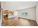Open-concept living area with hardwood floors, a view of the kitchen and ample natural light at 2771 Aralynn Way, College Park, GA 30337