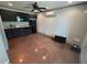 An efficient kitchenette with black cabinets, granite countertops, and stainless steel appliances at 300 Outlaw Rdg, Canton, GA 30115