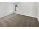 This bedroom features neutral carpeting and a window to allow for plenty of natural light at 2910 Blake Towers Ln, Buford, GA 30519