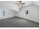 Bright bedroom featuring a ceiling fan and two windows for natural light at 2910 Blake Towers Ln, Buford, GA 30519